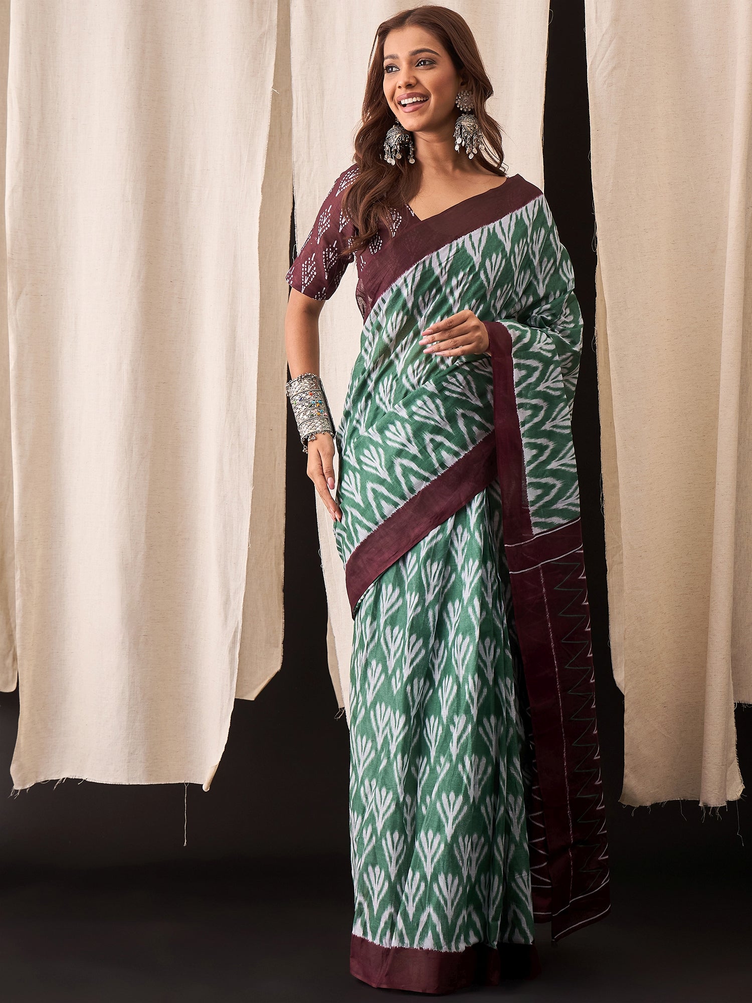 Green & Maroon Cotton Saree with Ikat-Inspired White Buta Motifs