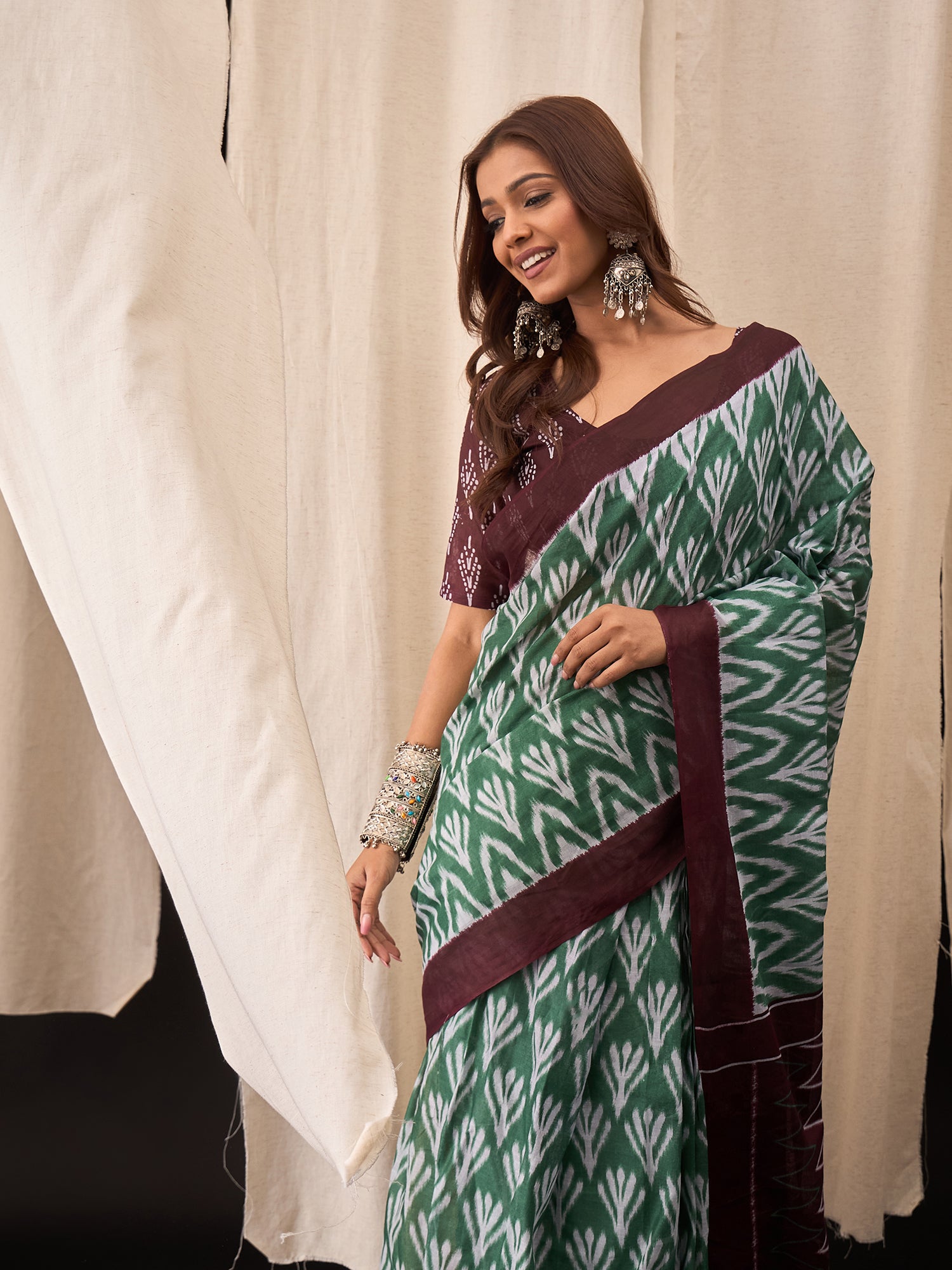 Green & Maroon Cotton Saree with Ikat-Inspired White Buta Motifs