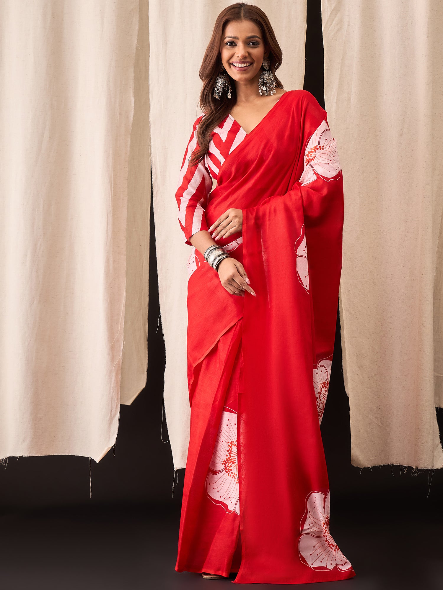 Festive Red Saree with Modern Floral Design & Striped Blouse
