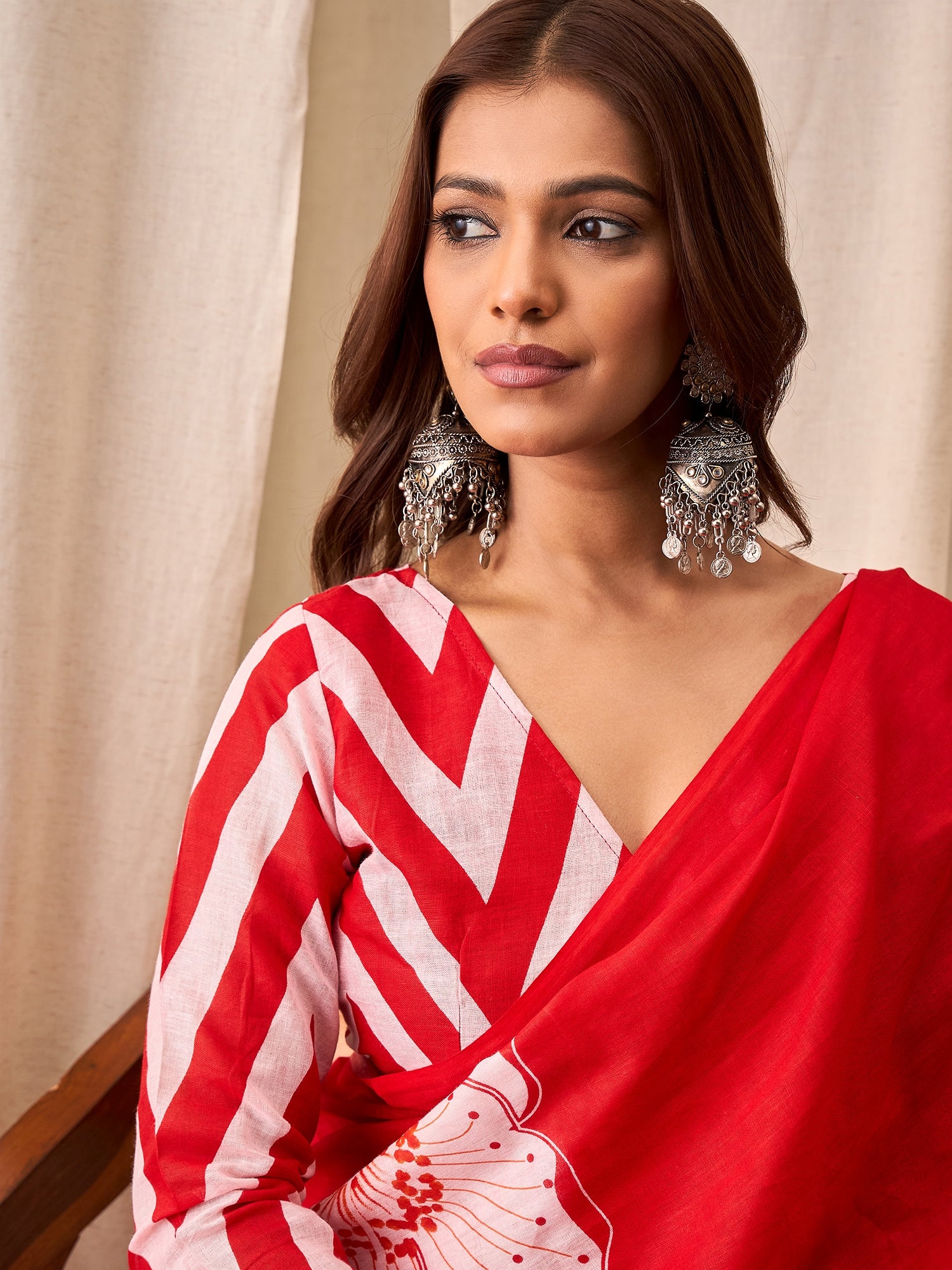 Festive Red Saree with Modern Floral Design & Striped Blouse