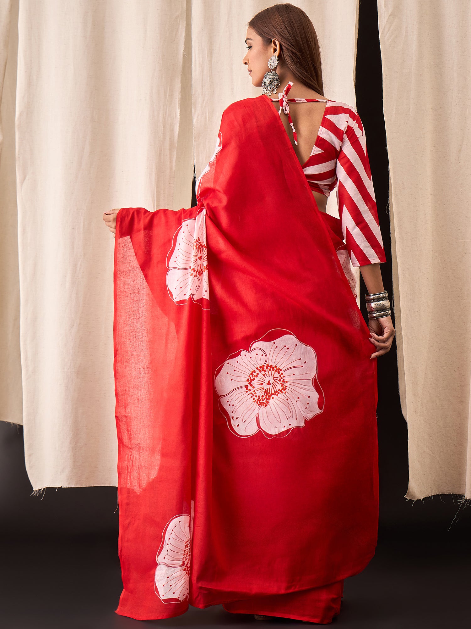 Festive Red Saree with Modern Floral Design & Striped Blouse
